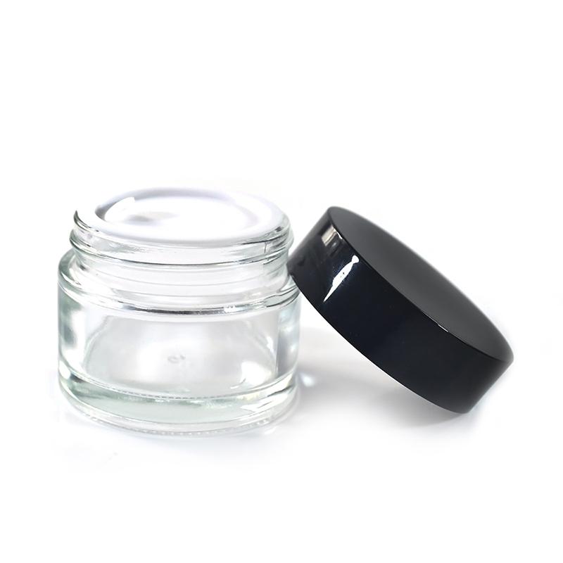 Wholesale cosmetic containers face cream jar 100g clear glass cream jar with black plastic lid