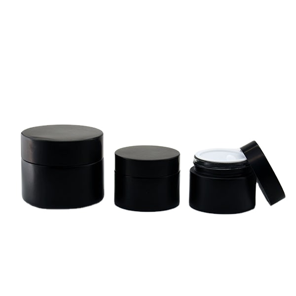 Wholesale cosmetic glass packaging 50g 100g black glass jar for cream , frosted cream glass jars