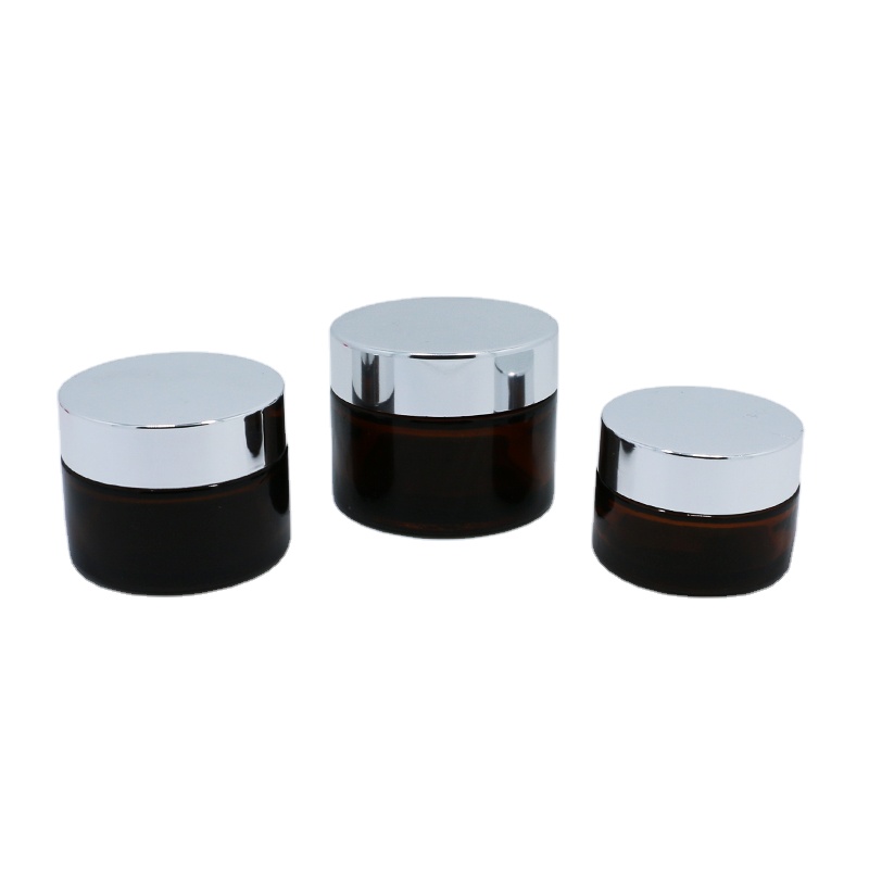 Wholesale cosmetic packaging 20ml 30ml 50ml amber glass jar with silver gold aluminum metal lids black plastic caps in stock