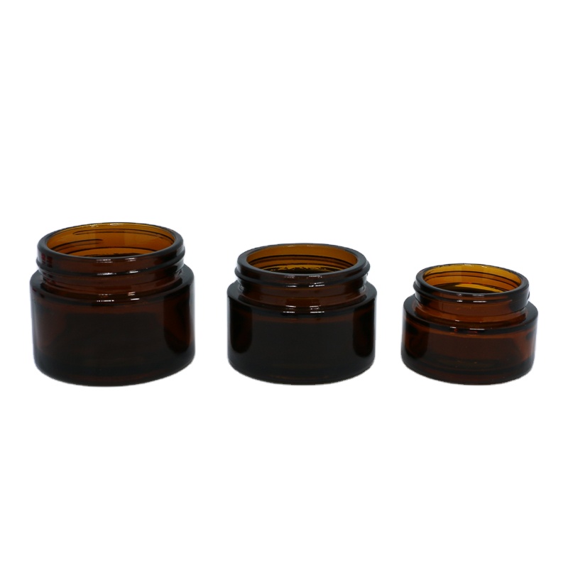 Wholesale cosmetic packaging 20ml 30ml 50ml amber glass jar with silver gold aluminum metal lids black plastic caps in stock