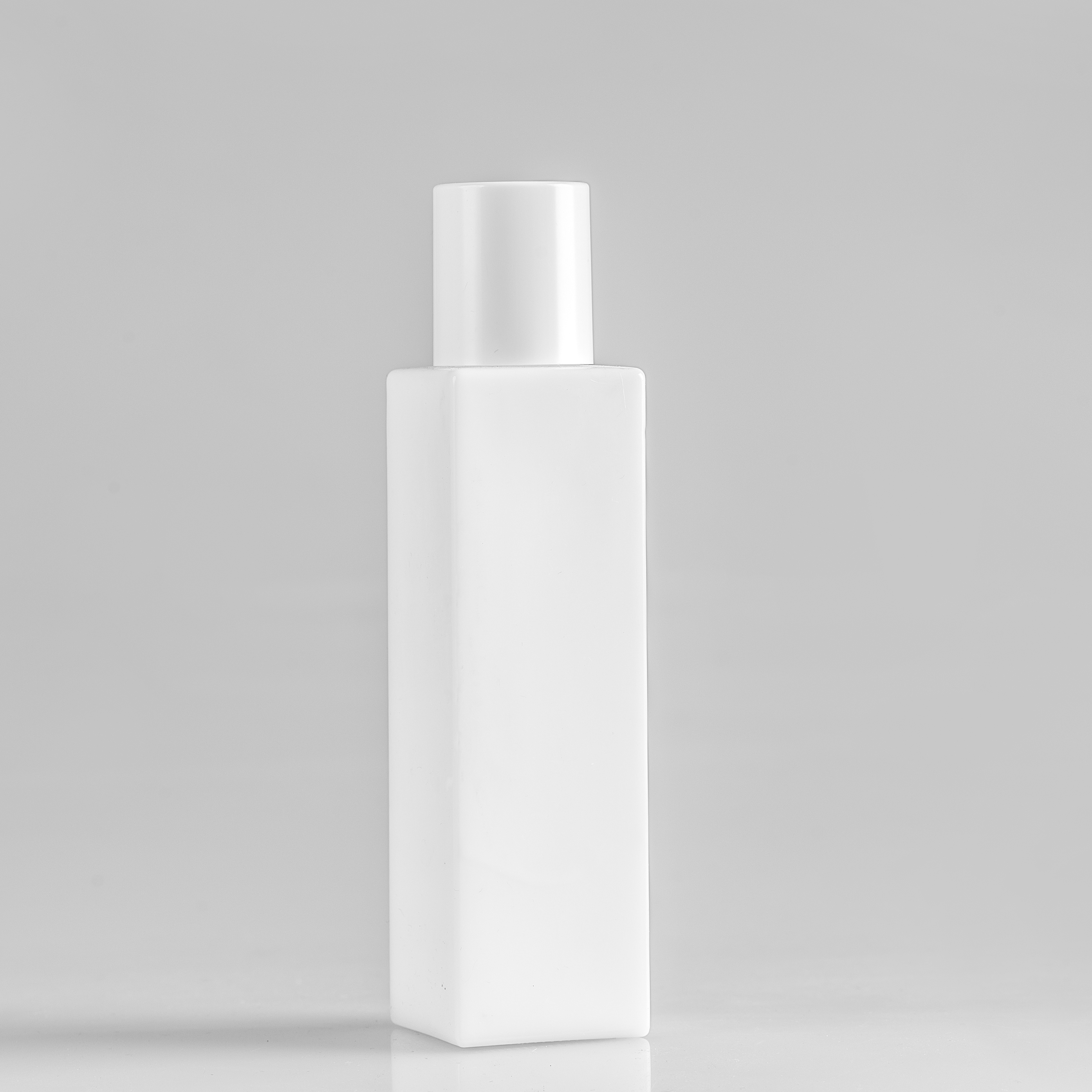 Wholesale cosmetic packaging white glass bottle