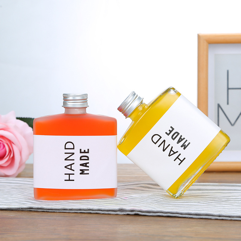 Wholesale creative flat square small wine bottle 200ml juice drink milk tea bottle net red frosted glass bottle