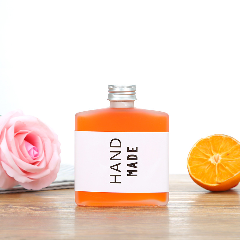 Wholesale creative flat square small wine bottle 200ml juice drink milk tea bottle net red frosted glass bottle