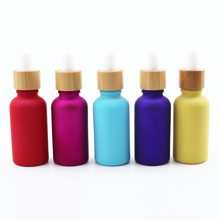 Wholesale custom color 30ml glass serum dropper bottle bamboo cap tincture bottle for cosmetic packaging