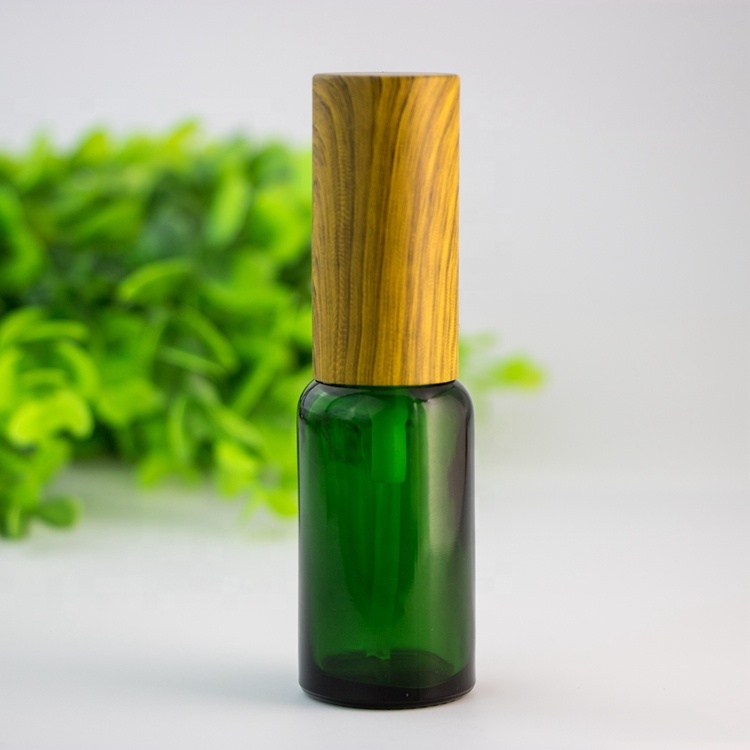 Wholesale custom eco-friendly bamboo lid green blue transparent amber glass spray bottle for skin care
