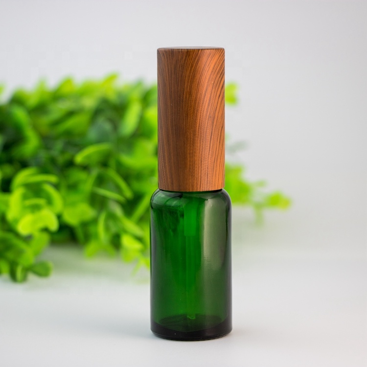 Wholesale custom eco-friendly bamboo lid green blue transparent amber glass spray bottle for skin care