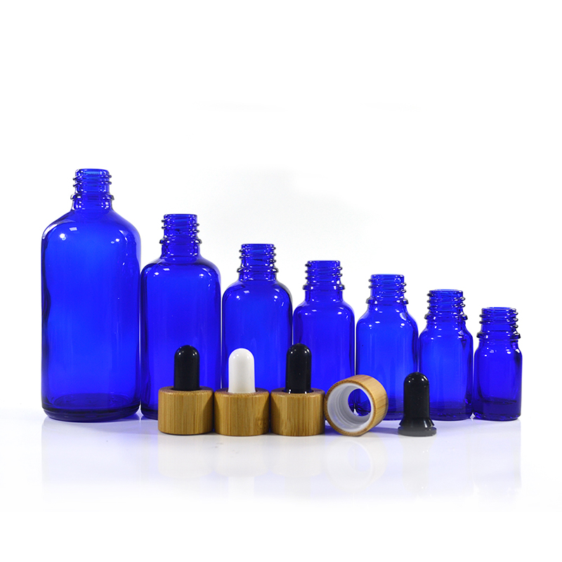 Wholesale custom made cosmetic packaging essential oil blue 30ml 50ml 100ml glass dropper bottle with bamboo cap