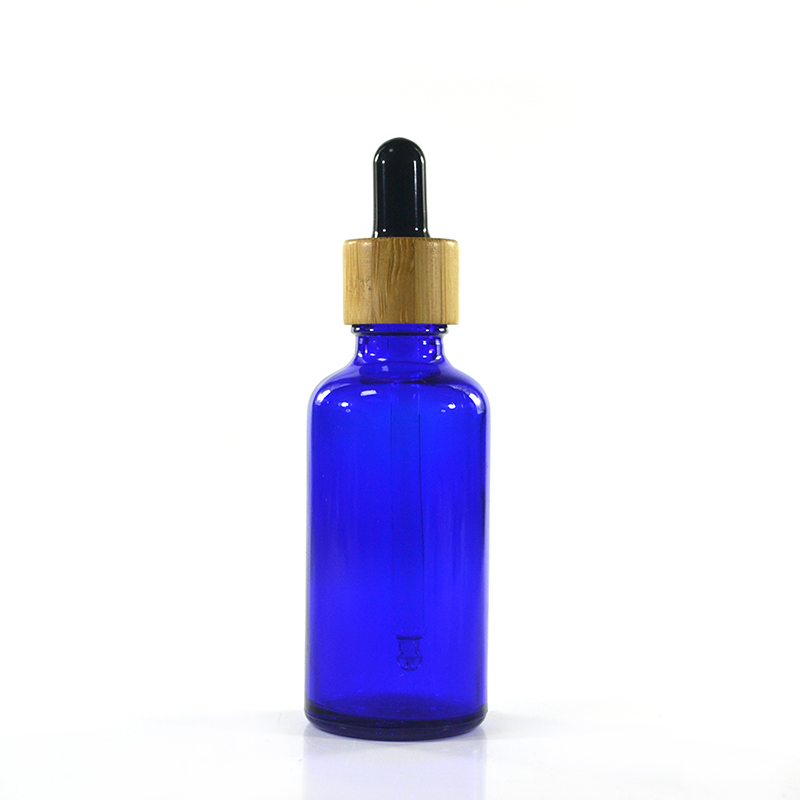 Wholesale custom made cosmetic packaging essential oil blue 30ml 50ml 100ml glass dropper bottle with bamboo cap