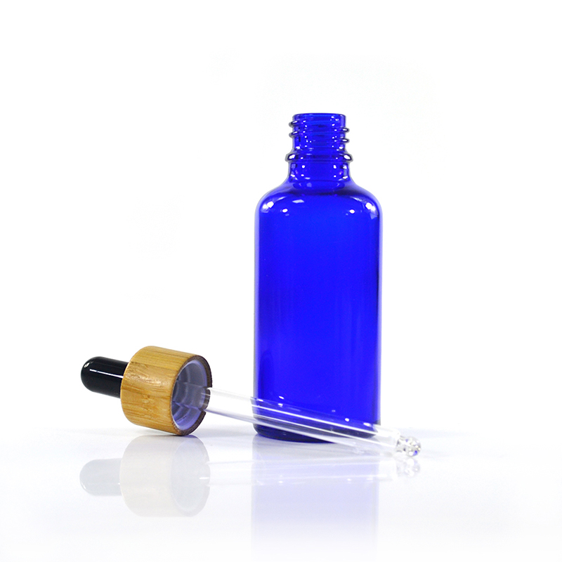 Wholesale custom made cosmetic packaging essential oil blue 30ml 50ml 100ml glass dropper bottle with bamboo cap