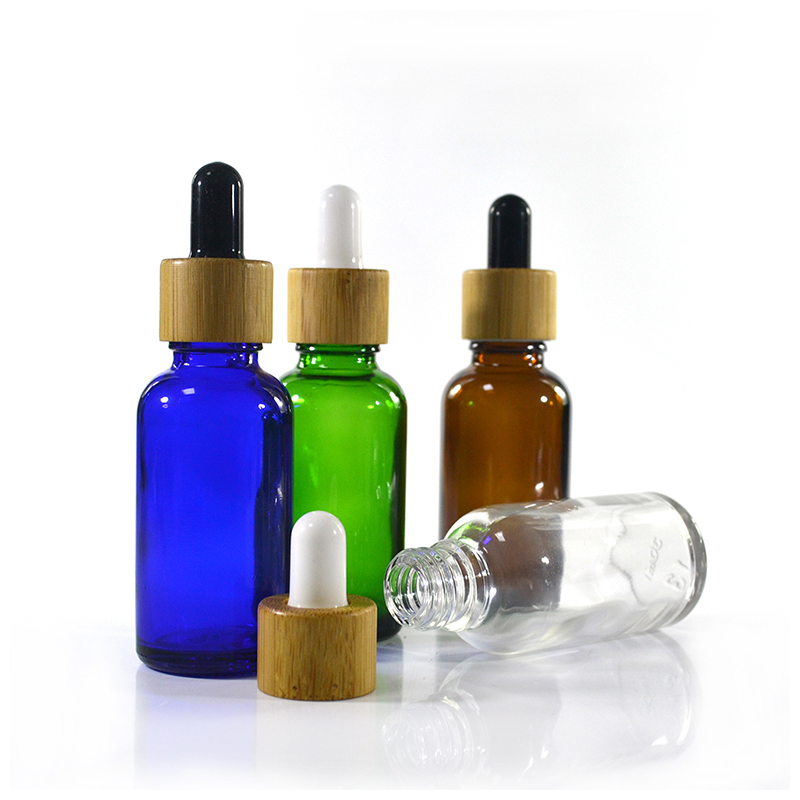 Wholesale custom made cosmetic packaging essential oil blue 30ml 50ml 100ml glass dropper bottle with bamboo cap
