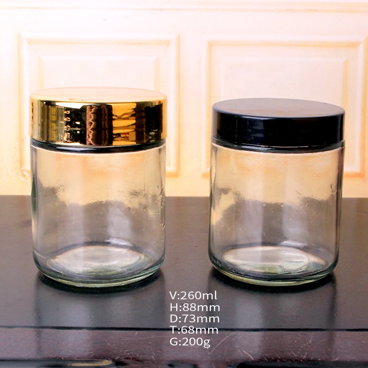 Wholesale customized 260ml clear round straight sided glass jars with screw lid for food candy honey caviar jam