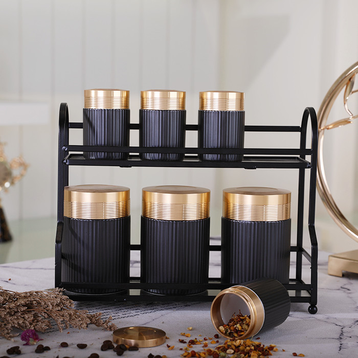 Wholesale elegant gold lid black kitchen sugar storage jar ceramic tea coffee canister sets with metal stand