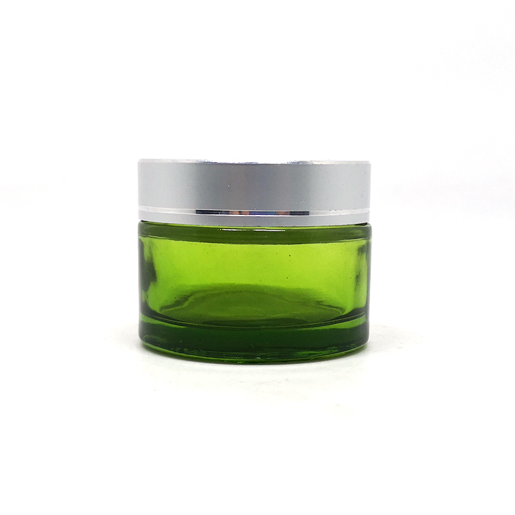 Wholesale emballage cosmtique 50g green glass jar cosmetic with silver cap