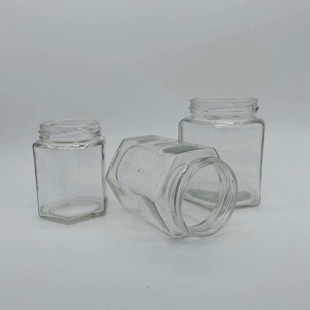 Wholesale empty hexagon natural royal honey jar container glass honey jar with dipper