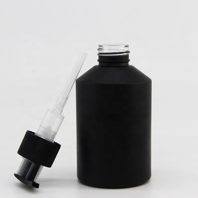 Wholesale essential oil glass bottle in 200 ml with pump head and slanted shoulder glass body