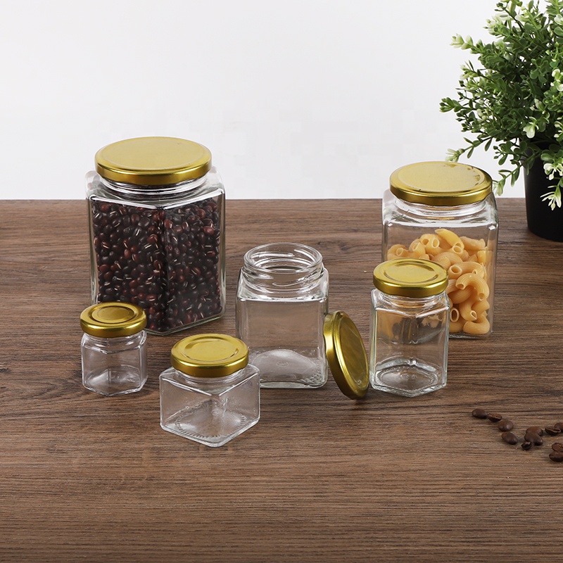 Wholesale food container hexagon glass jars with golden metal closure 50ml 70ml 100ml 300ml 500ml 750ml