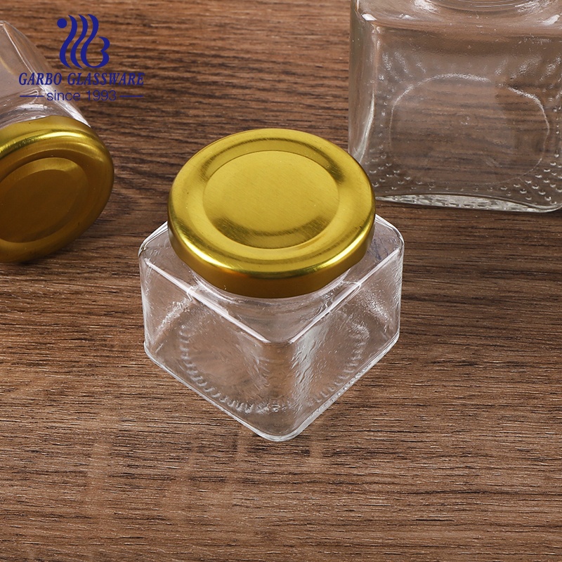 Wholesale food container hexagon glass jars with golden metal closure 50ml 70ml 100ml 300ml 500ml 750ml