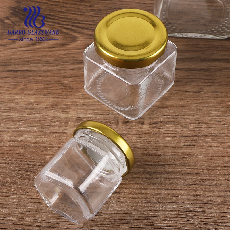 Wholesale food container hexagon glass jars with golden metal closure 50ml 70ml 100ml 300ml 500ml 750ml