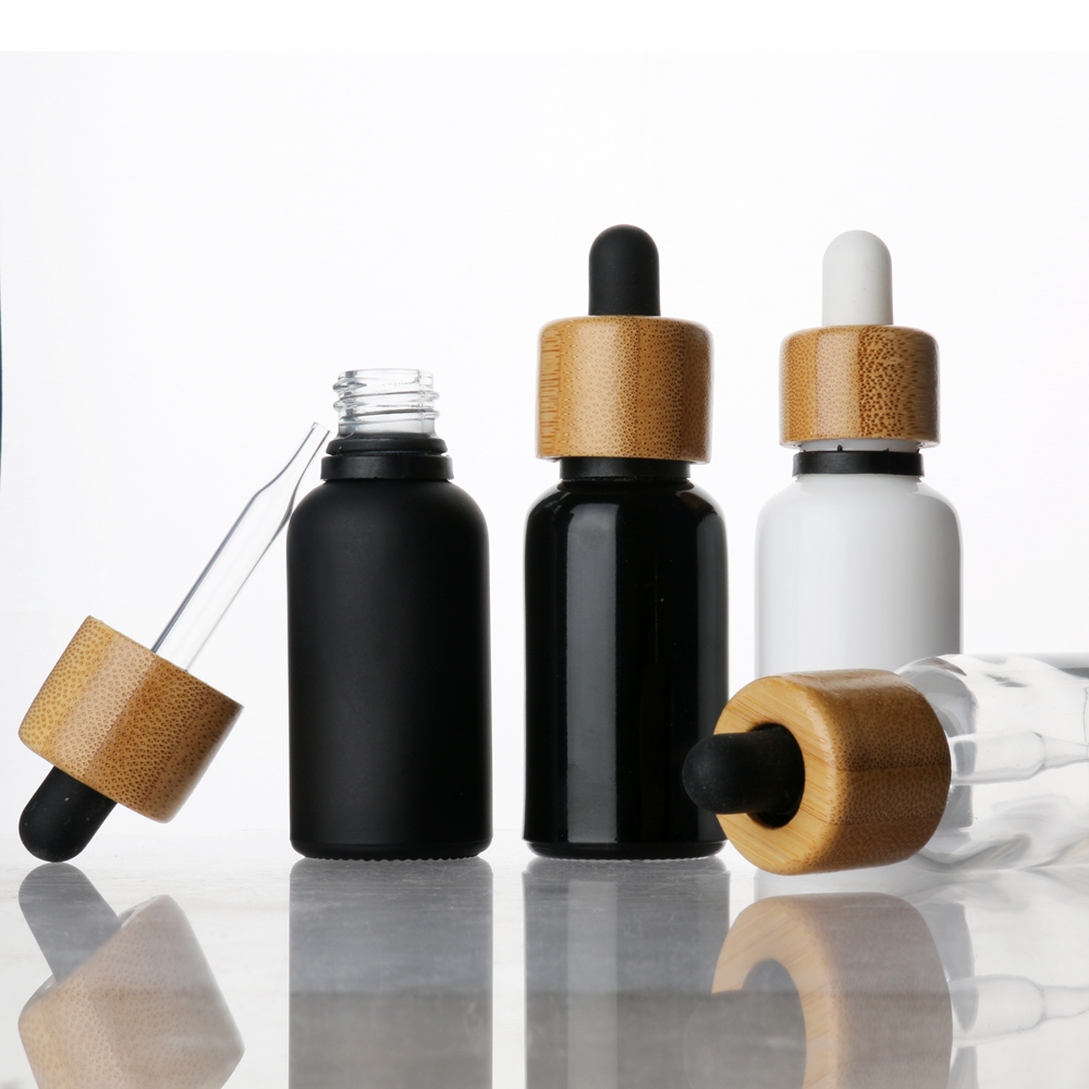 Wholesale glass Dropper Bottle essential oil bottle CBD glass bottle with bamboo lid