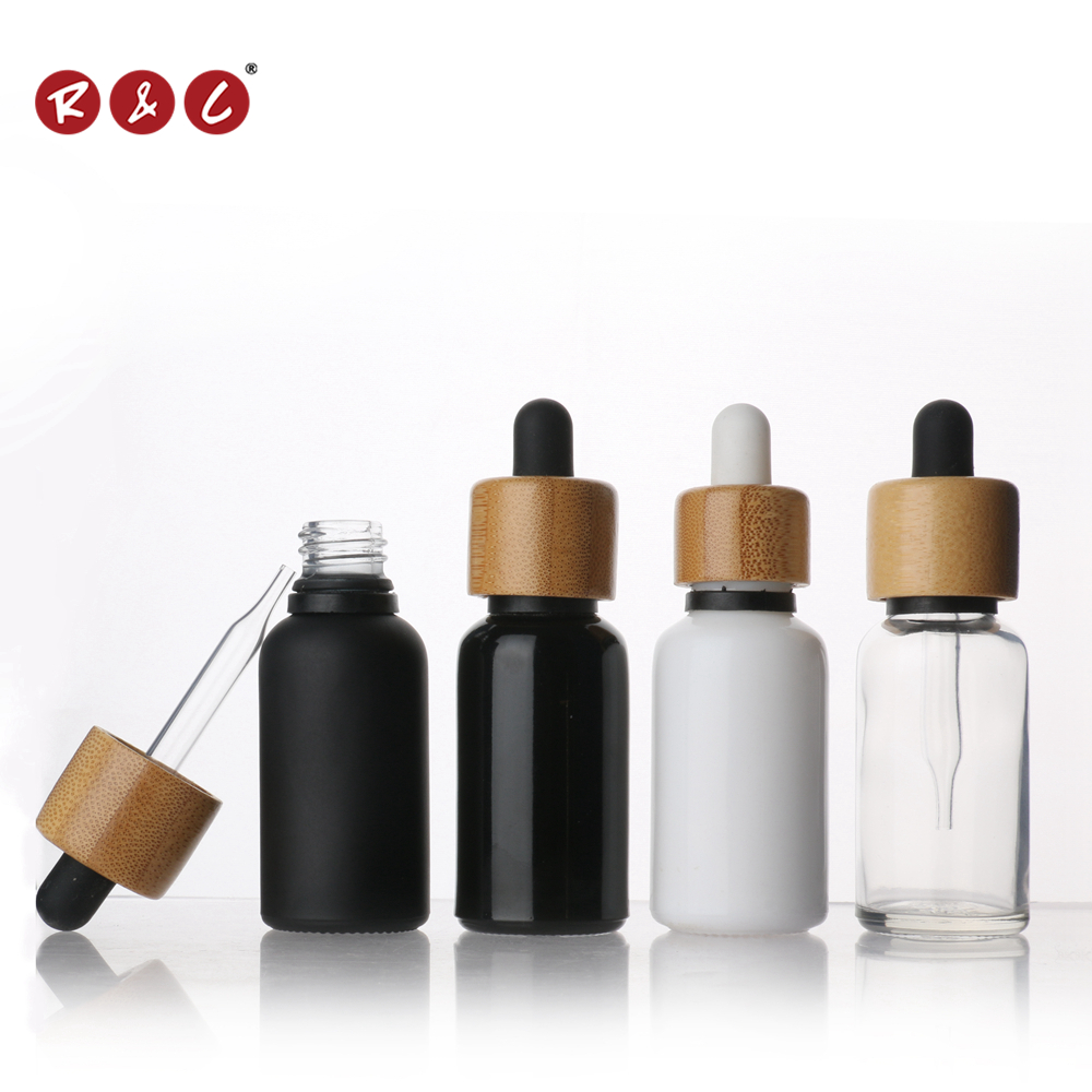 Wholesale glass Dropper Bottle essential oil bottle CBD glass bottle with bamboo lid