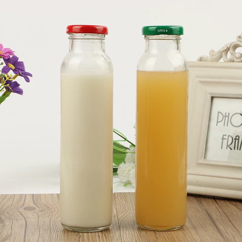Wholesale heat-resistant 350 ml round glass bottle milk juice glass beverage bottles with mental lid