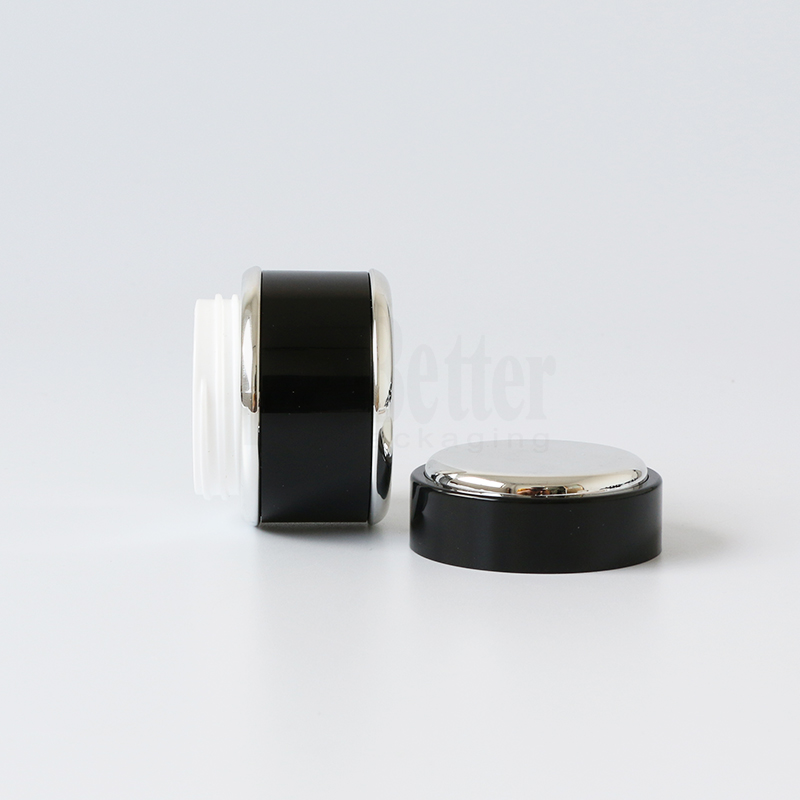 Wholesale high end double wall 50ml 50g round shape plastic black and gold herbal whitening face cream jar