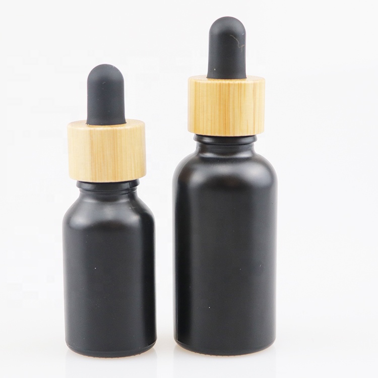 Wholesale high quality bamboo glass packaging 1oz 2oz beard oil bottles essential oil bottle with bamboo cap