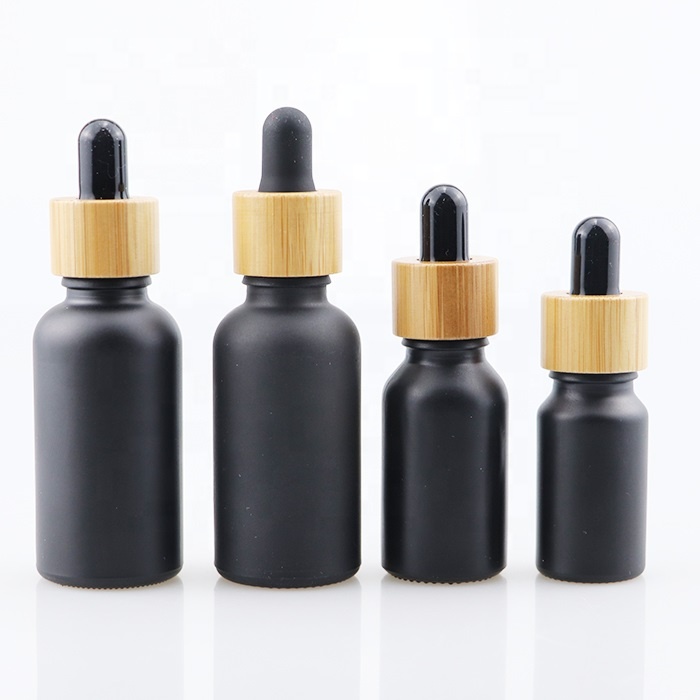 Wholesale high quality bamboo glass packaging 1oz 2oz beard oil bottles essential oil bottle with bamboo cap