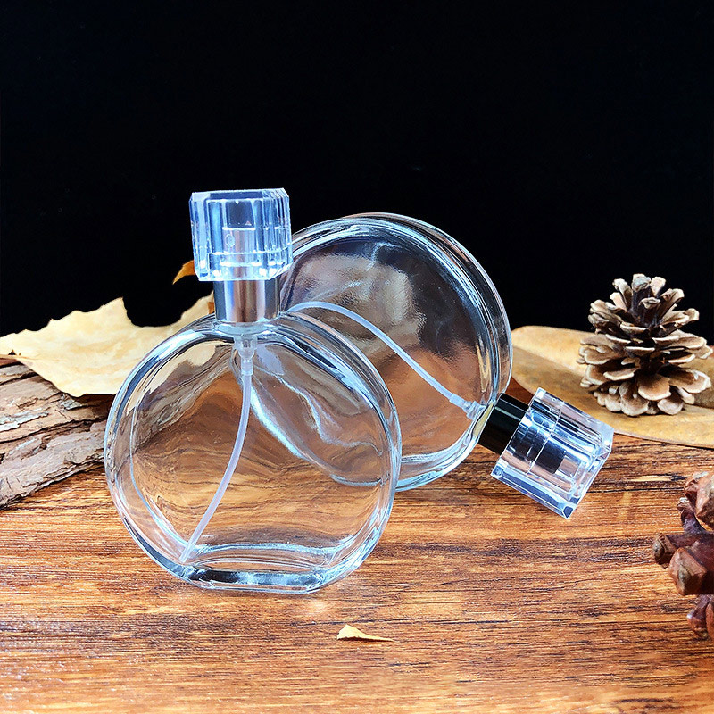 Wholesale hot selling packaging round 50ML100ml pressed glass perfume bottle