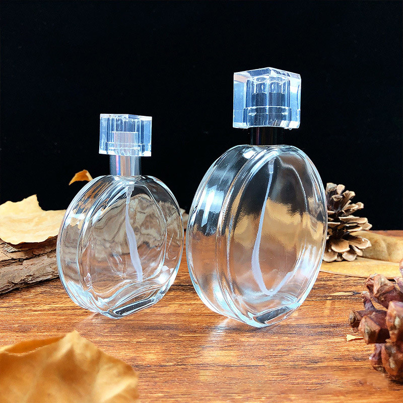 Wholesale hot selling packaging round 50ML100ml pressed glass perfume bottle