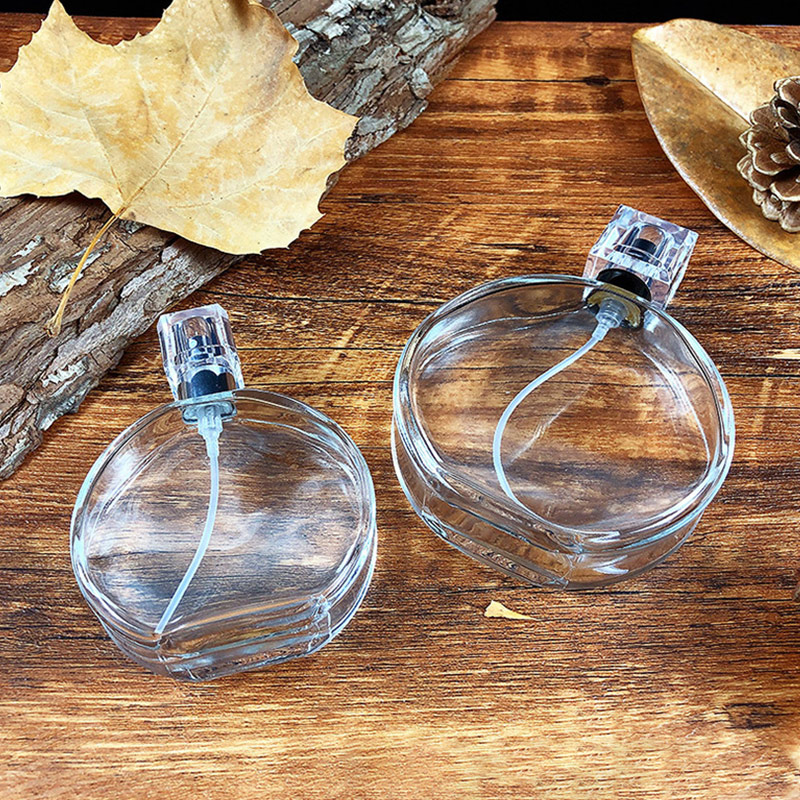 Wholesale hot selling packaging round 50ML100ml pressed glass perfume bottle