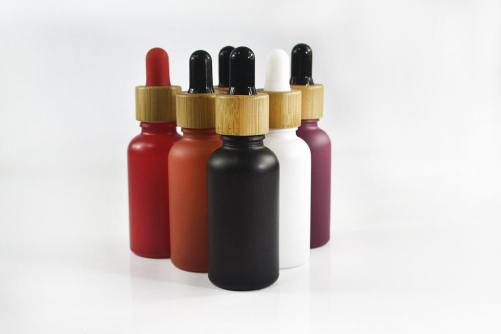 Wholesale matte red blue green black 5ml 10ml 15ml 20ml 30ml 50ml 100ml glass dropper bottle with bamboo lid