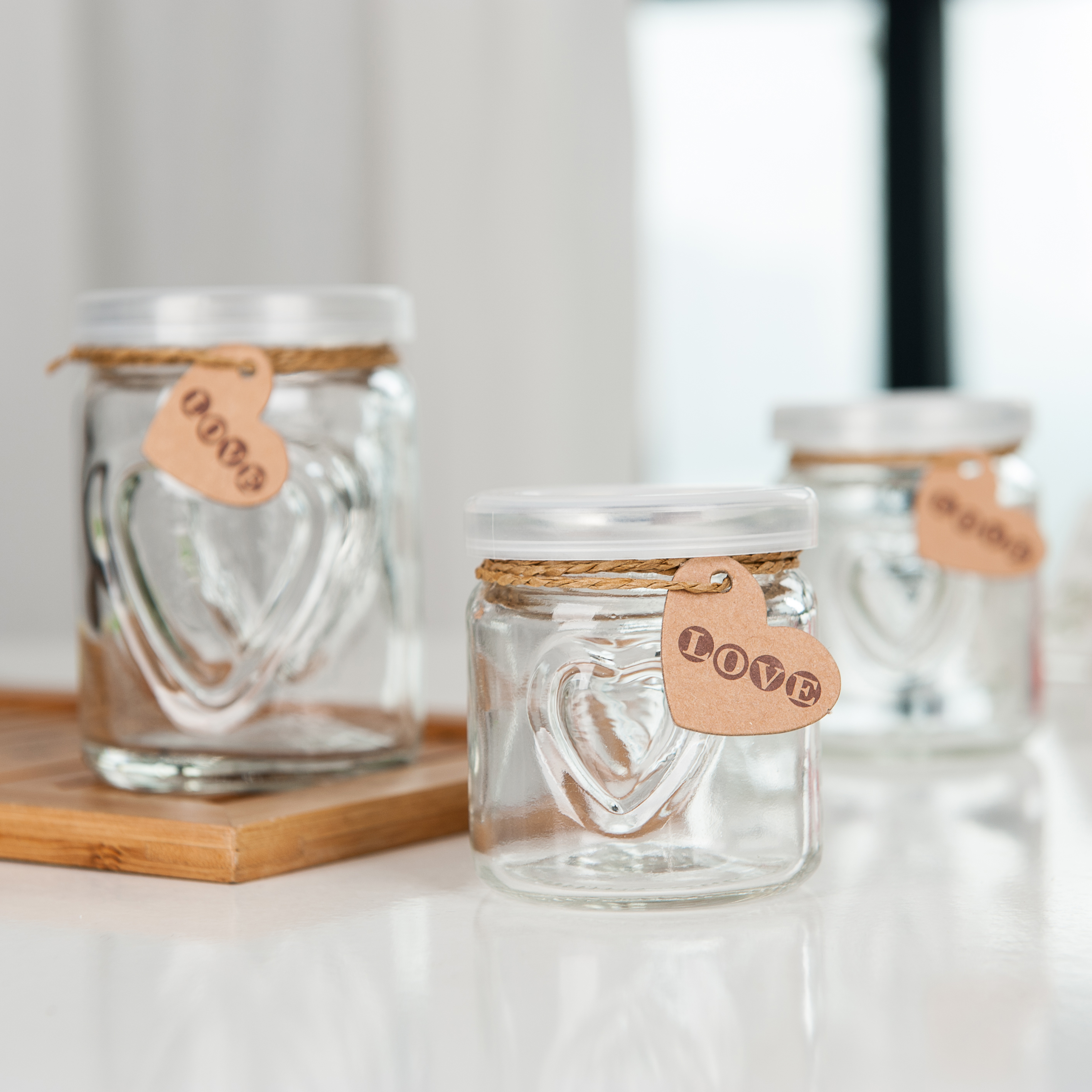 Wholesale mini clear empty container heart carved shape milk juice glass pudding bottle with plastic cap
