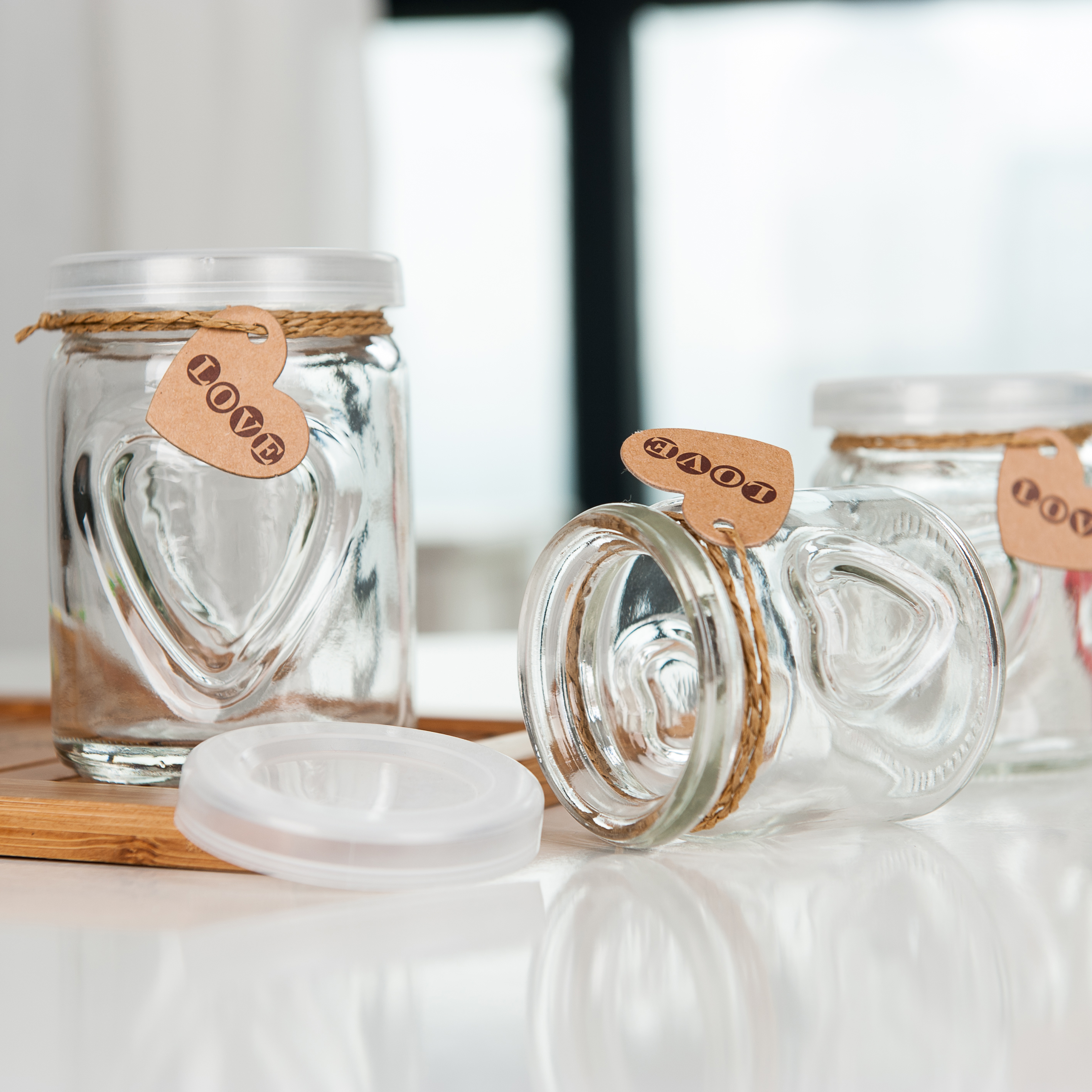 Wholesale mini clear empty container heart carved shape milk juice glass pudding bottle with plastic cap