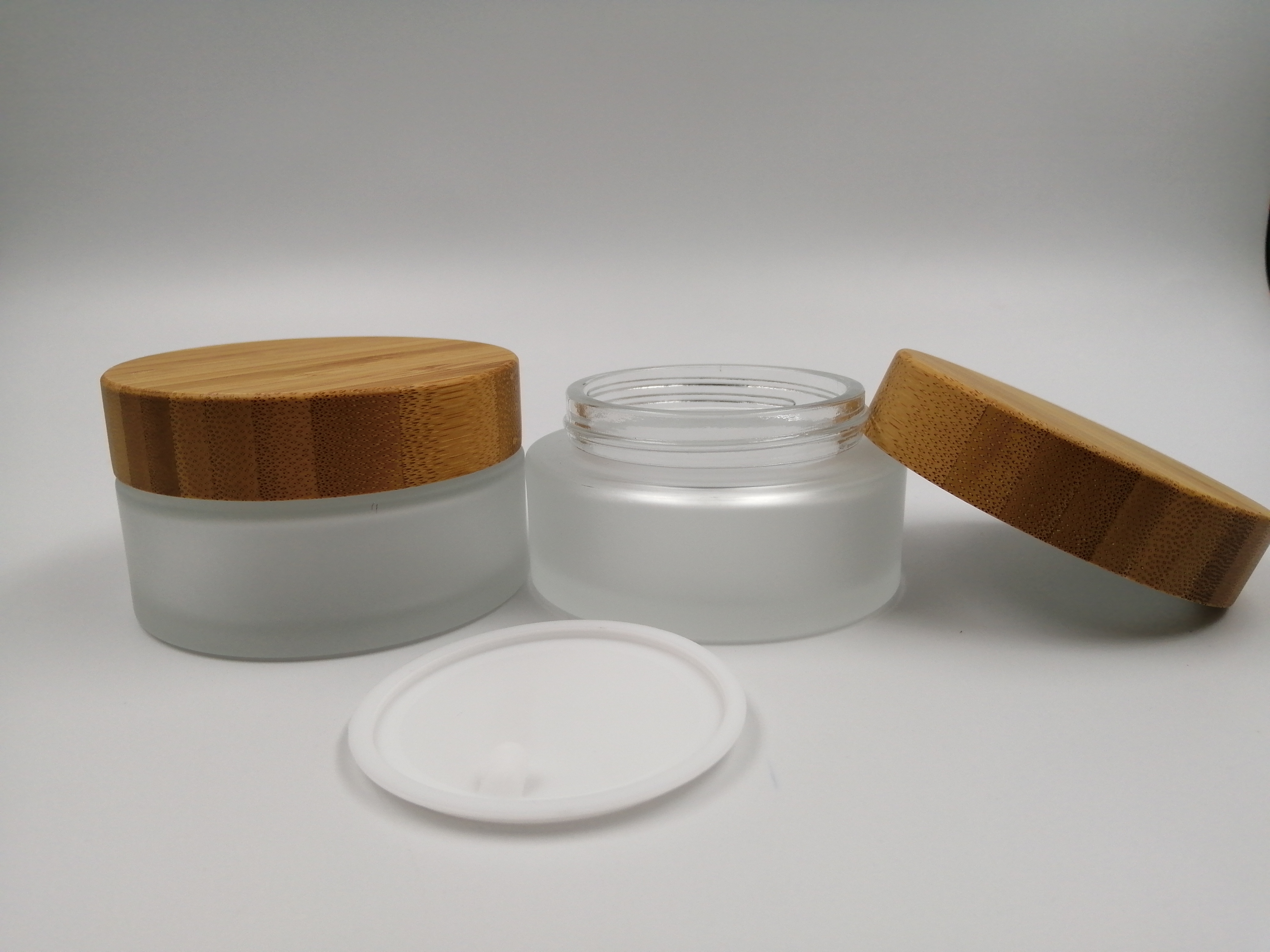 Wholesale natural bamboo lid cream frosted cosmetics container glass jar