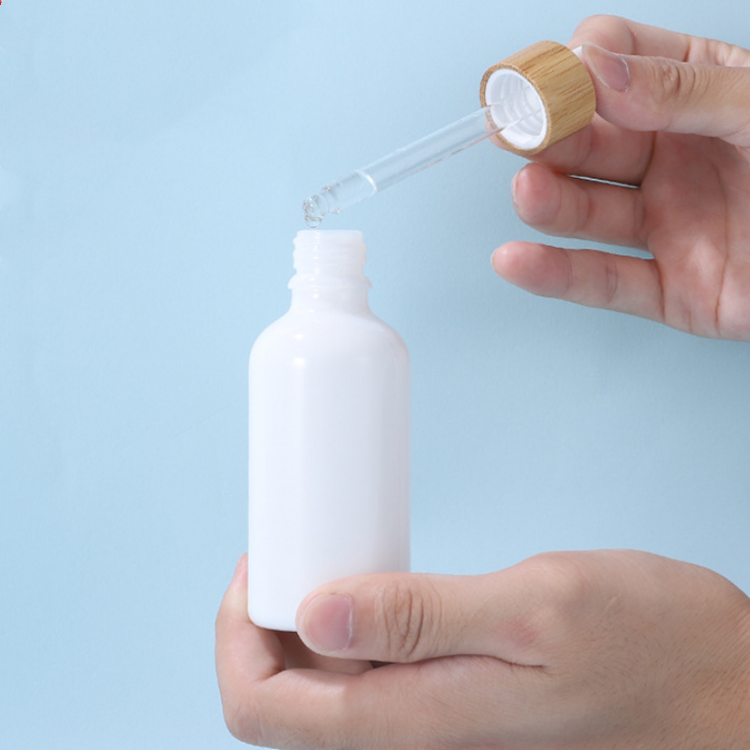 Wholesale natural white 1 oz 30ml essential oil glass dropper white porcelain bottle with bamboo wood lid cap