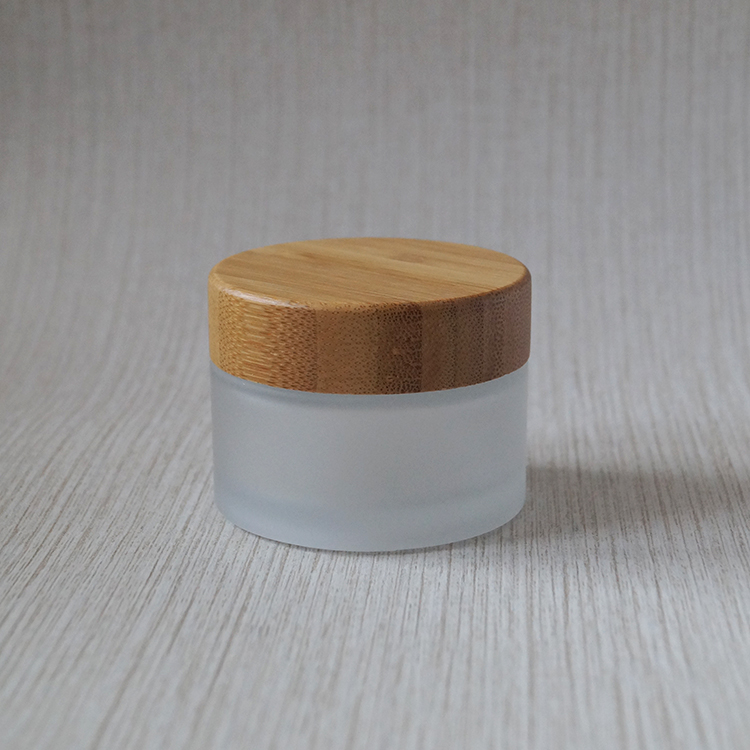 Wholesale new design 30ml 50ml 100ml cosmetic frosted glass jar with bamboo lids