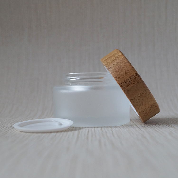 Wholesale new design 30ml 50ml 100ml cosmetic frosted glass jar with bamboo lids