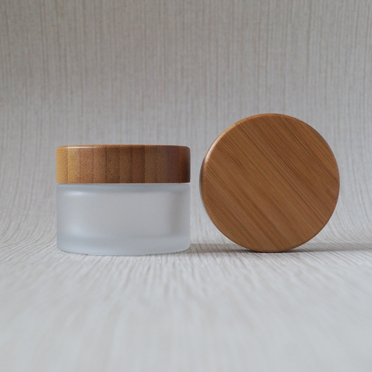 Wholesale new design 30ml 50ml 100ml cosmetic frosted glass jar with bamboo lids