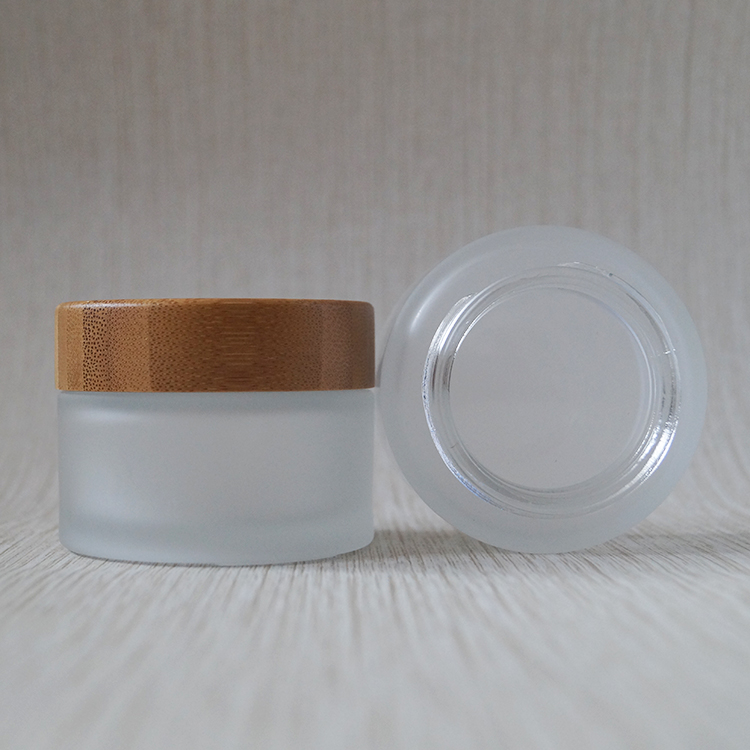 Wholesale new design 30ml 50ml 100ml cosmetic frosted glass jar with bamboo lids