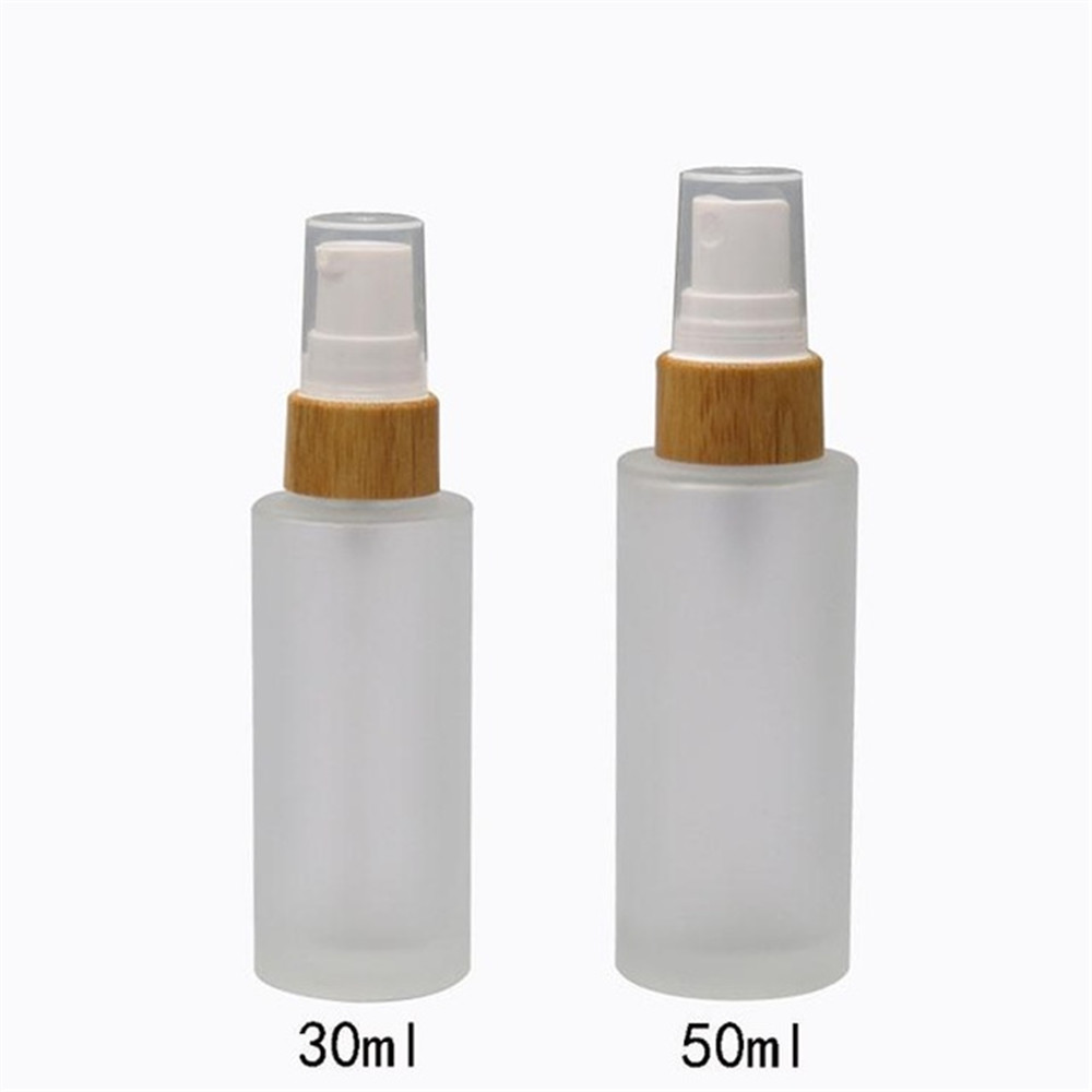 Wholesale new style luxury 30ml 50ml 100ml refillable frosted glass cosmetic mist spray toner bottle atomiser with bamboo cap