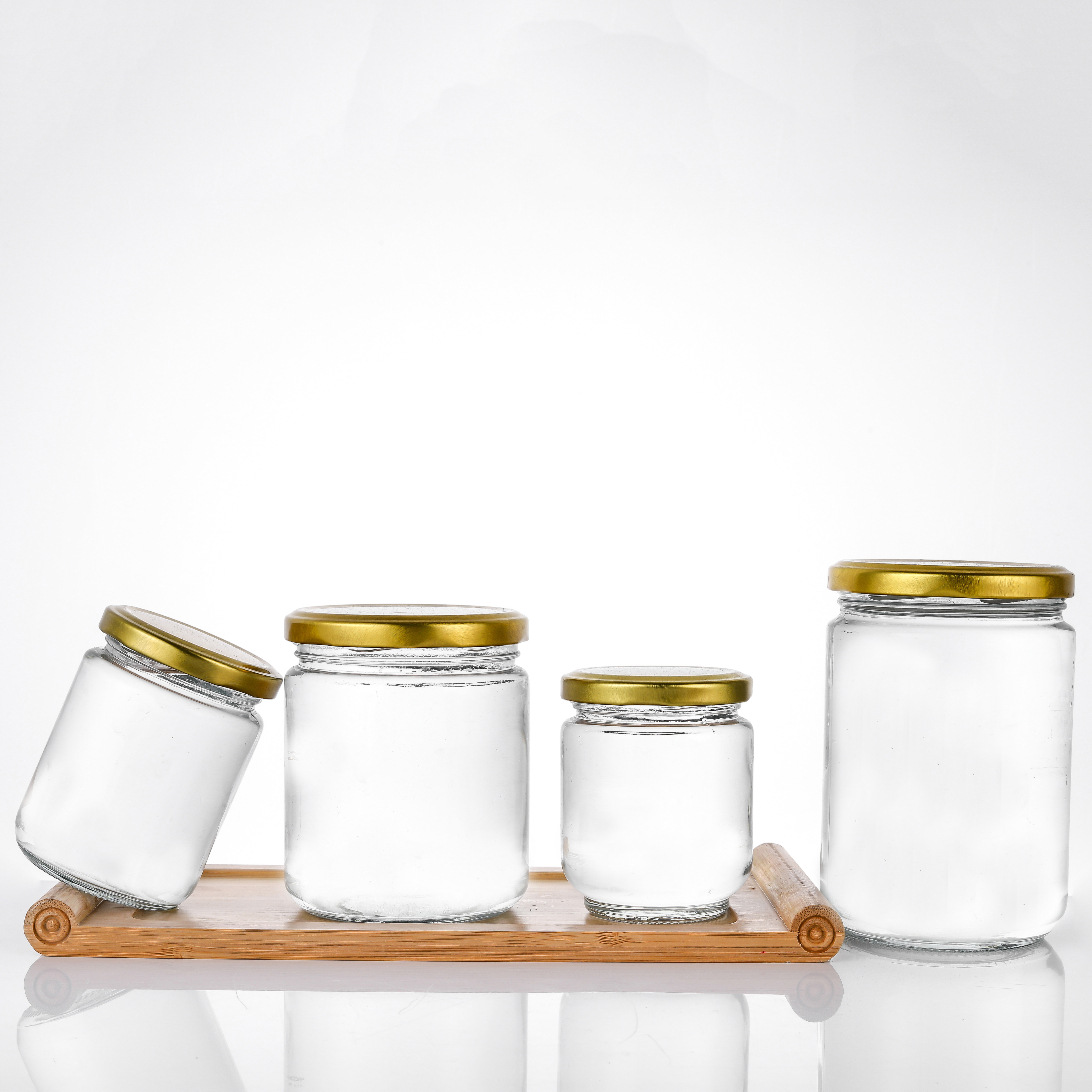 Wholesale price customized clear round airtight glass jars with screw lid for canned fruit honey caviar jam