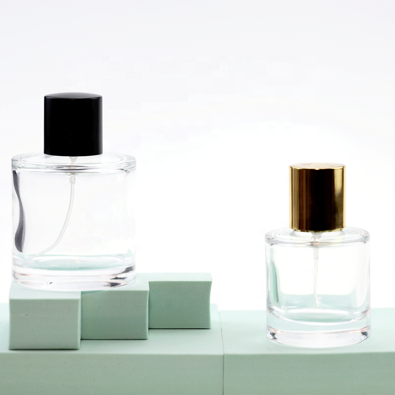 Wholesale round glass 100ml perfume bottle with black cap