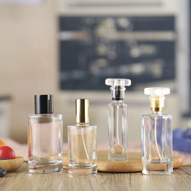 Wholesale round perfume bottle glass bottle and spray head 50ml perfume bottle luxury