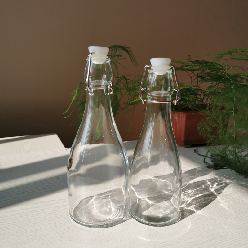 Wholesale swing top 250 glass bottles airtight glass beverage bottles with custom logo
