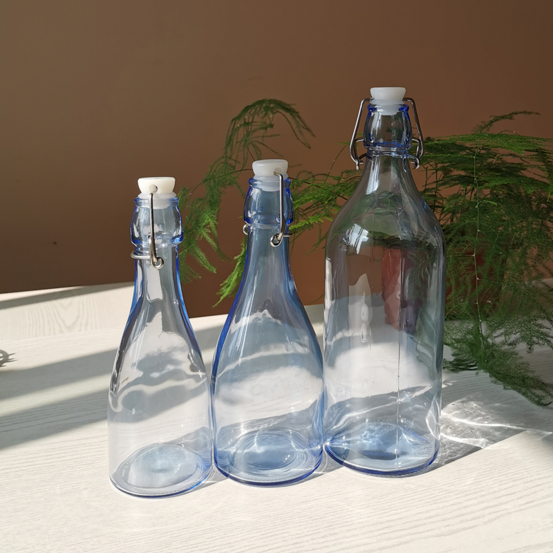 Wholesale swing top 250 glass bottles airtight glass beverage bottles with custom logo