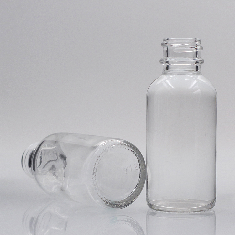 Wholesale transparent boston round glass bottle