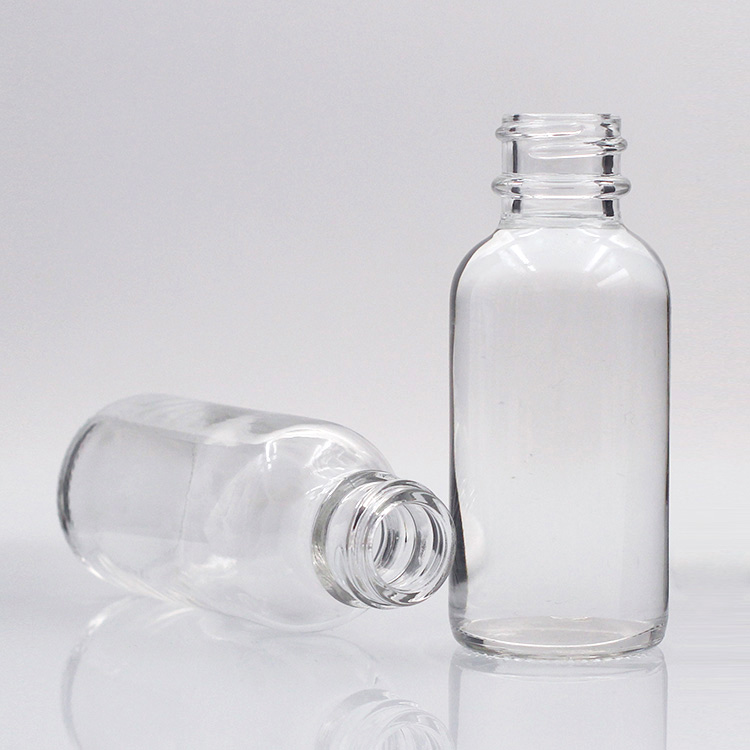 Wholesale transparent boston round glass bottle