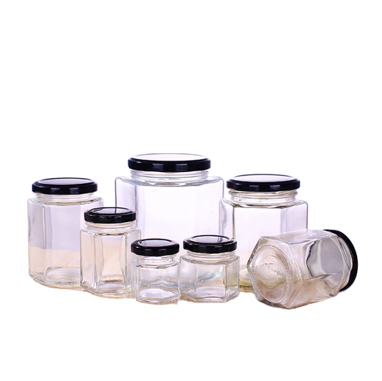 Wholesaler 180ml 280ml 380ml hexagon food honey storage glass jars for canning with black metal lid