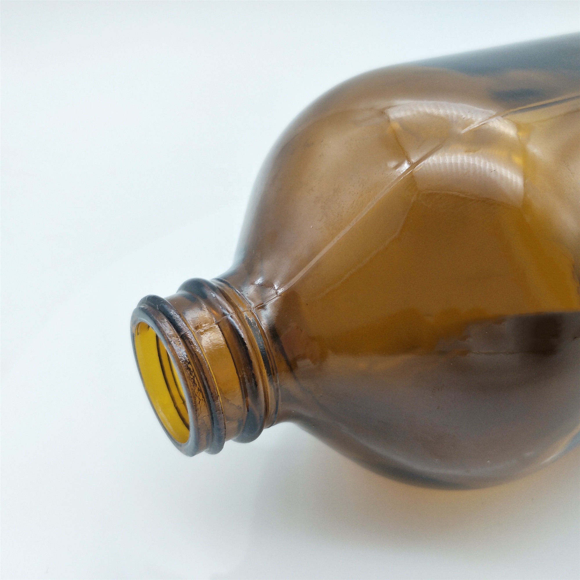 Wholesales 32oz Boston round amber glass bottle